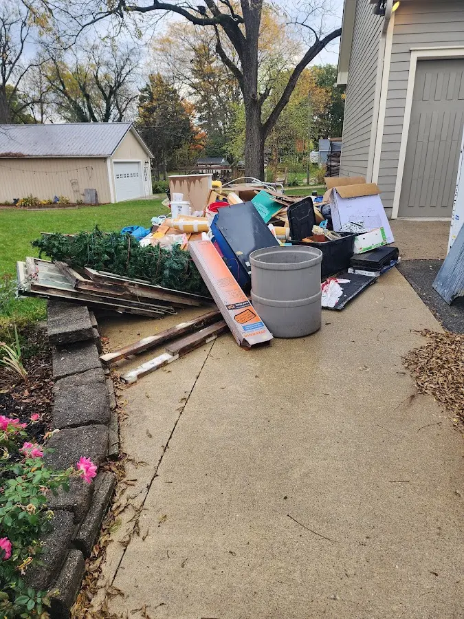 Dumpster being loaded with debris for Residential Dumpster Rental in Tea